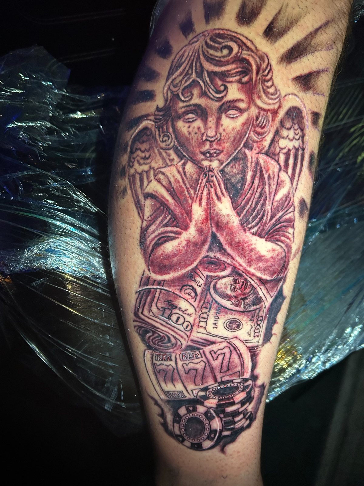 Black and grey angel and money tattoo redesign by Joshua Cole