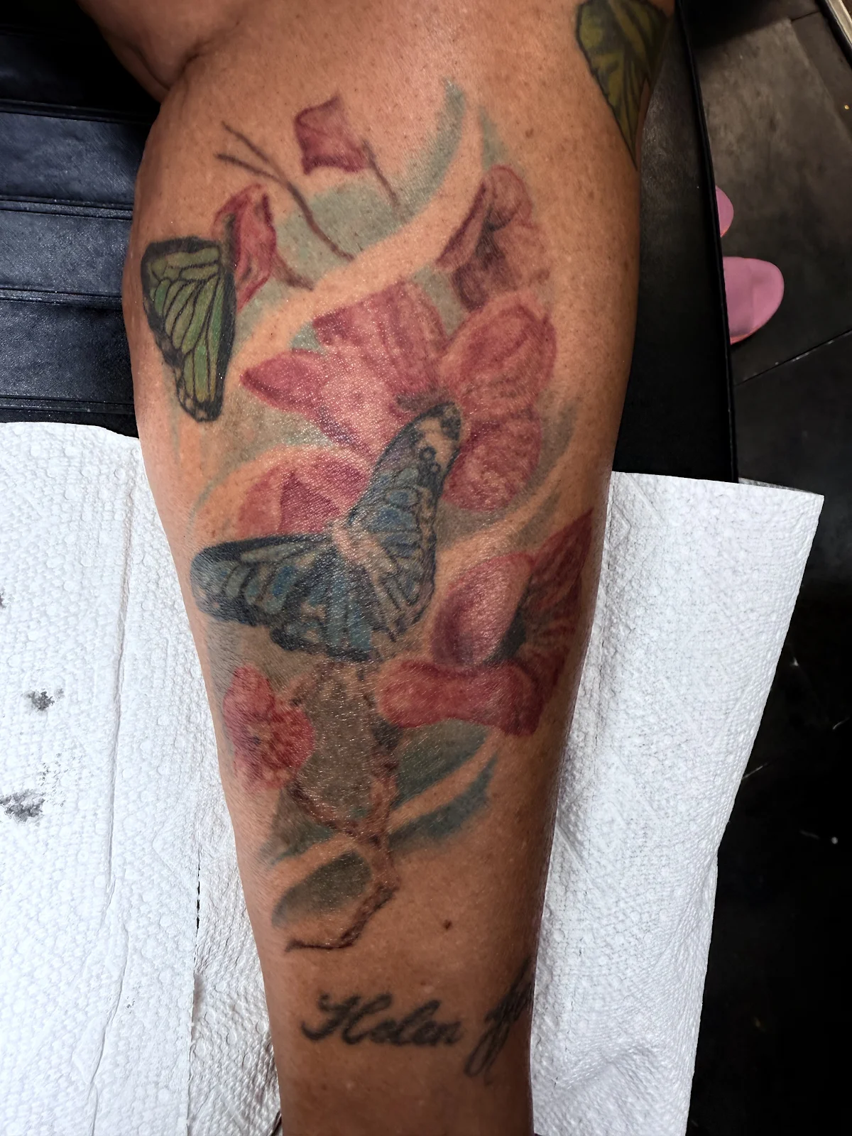 Consult photo — aged floral leg tattoo before cover-up consult, Las Vegas