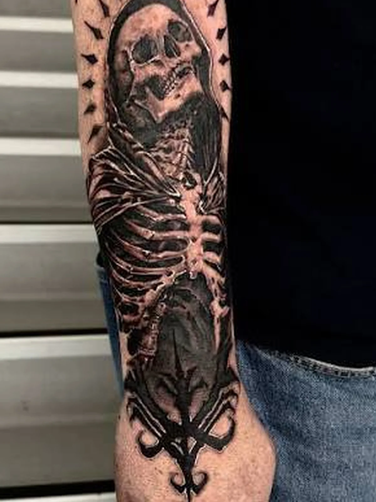 Black and grey skeleton reaper hand realism tattoo — Work of Art Tattoo Las Vegas