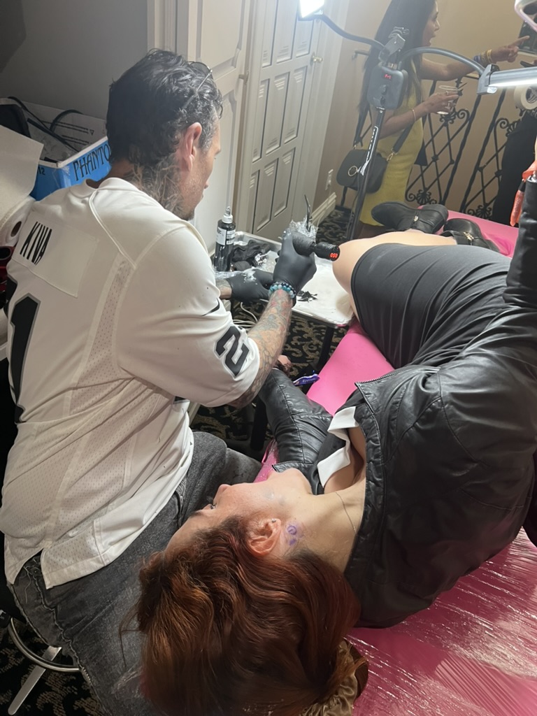 Small Bitcoin logo tattoo completed at private offsite event — Joshua Cole, Work of Art Las Vegas