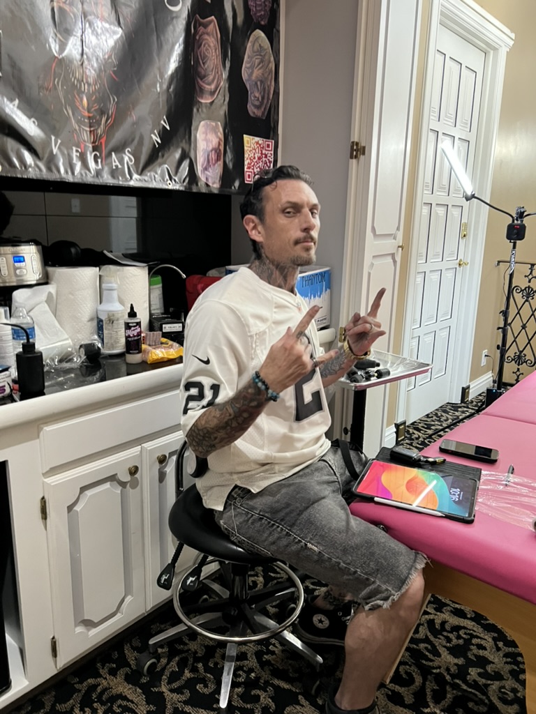 Joshua Cole working on small tattoo at private party — Work of Art Las Vegas