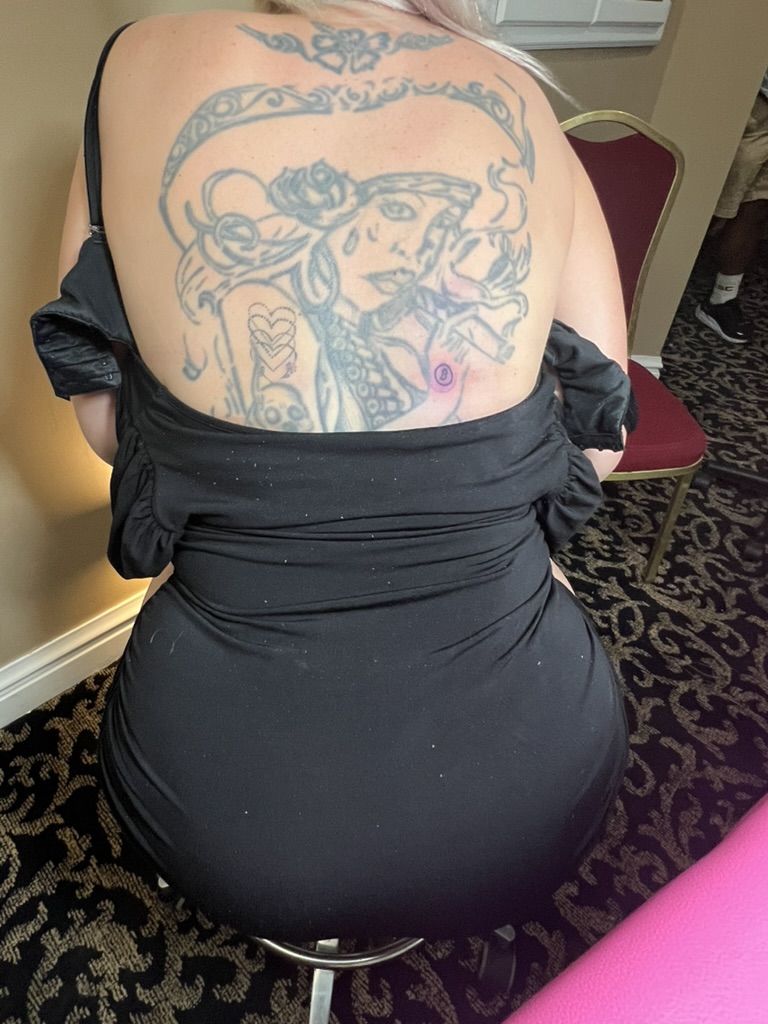 Joshua Cole at portable tattoo station — Work of Art Las Vegas offsite booking
