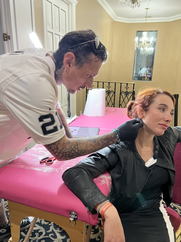 Joshua Cole and client preparing for tattoo at portable offsite station