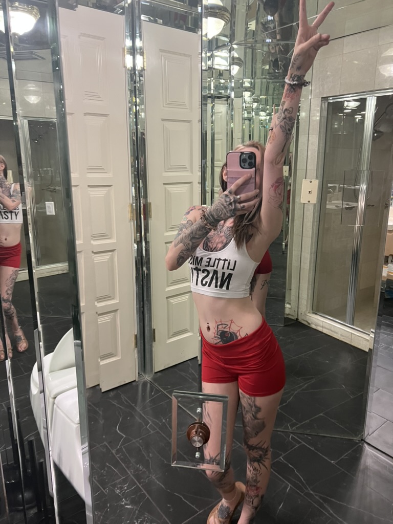 Client mirror selfie showing black widow spider stomach tattoo and full body ink offsite — Joshua Cole offsite booking, Work of Art Las Vegas