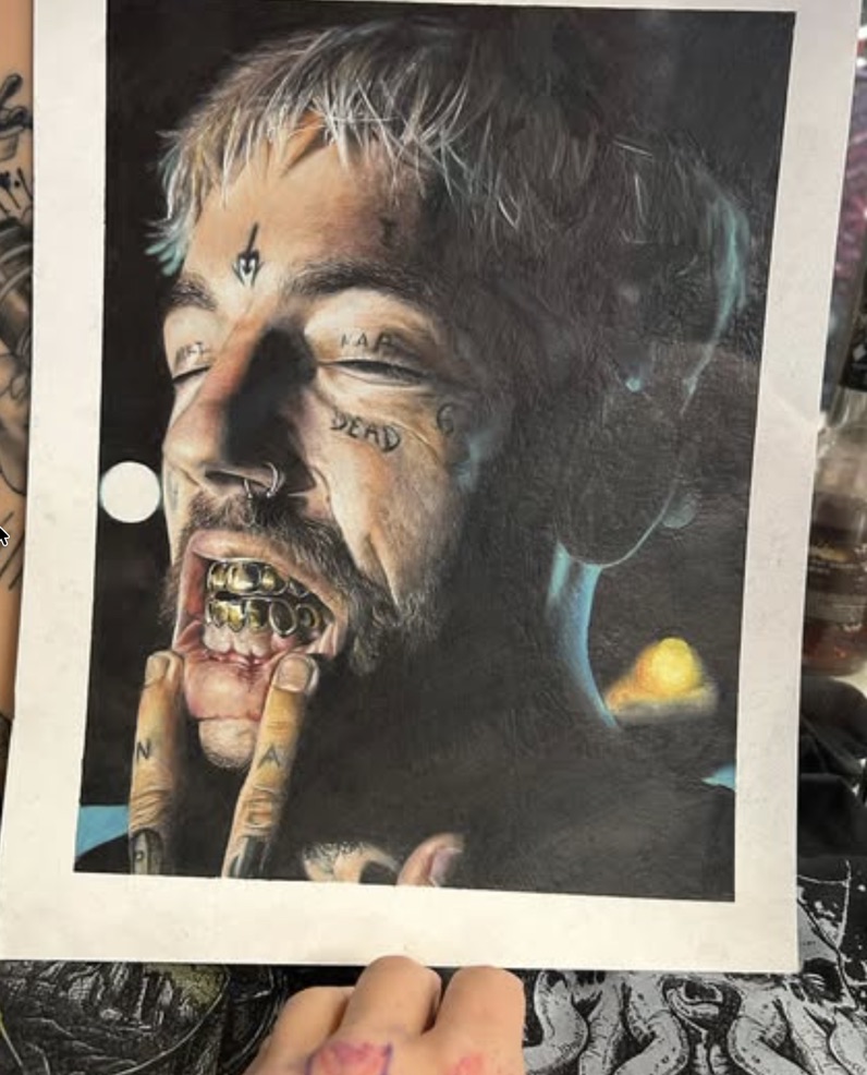 Color realism portrait of face-tattooed man revealing gold grillz artwork. — Joshua Cole, Work of Art Las Vegas