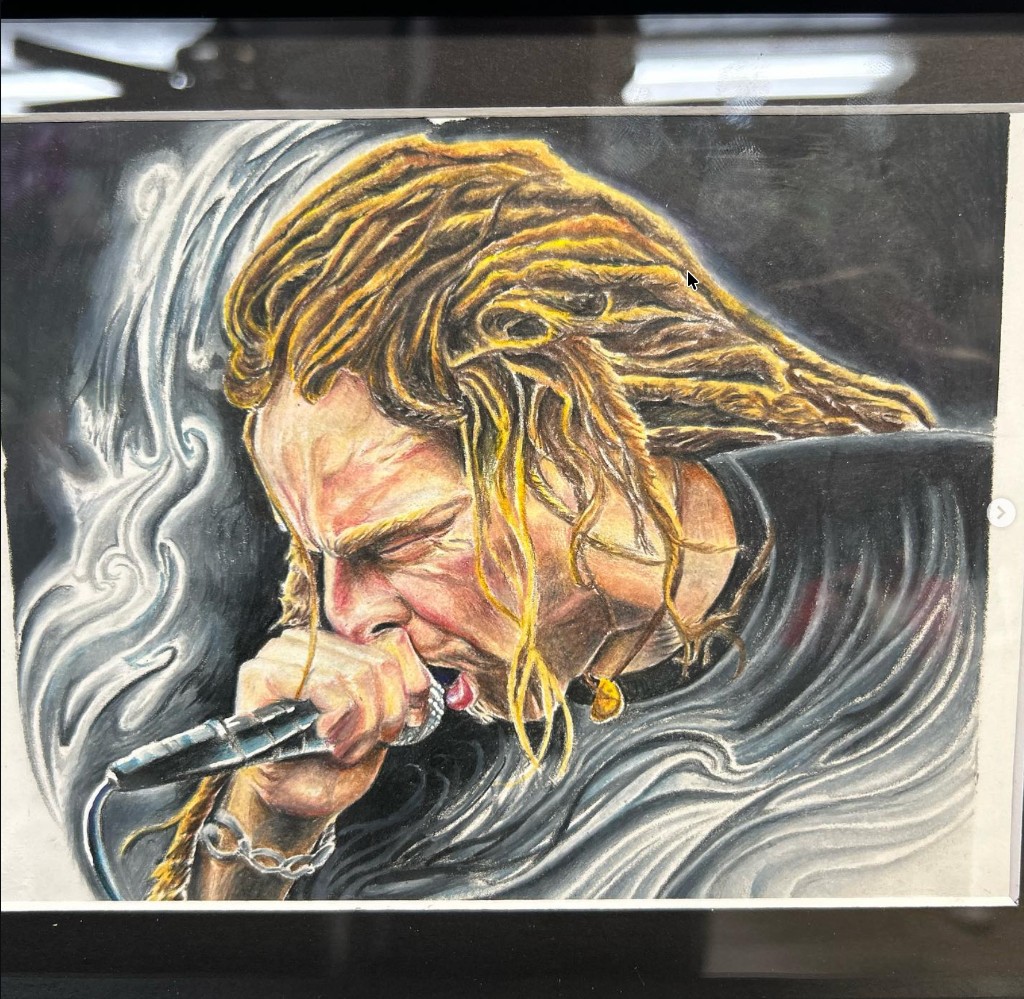 Framed color drawing of blonde dreadlocked singer screaming into a mic with smoke swirl — Joshua Cole, Work of Art Las Vegas