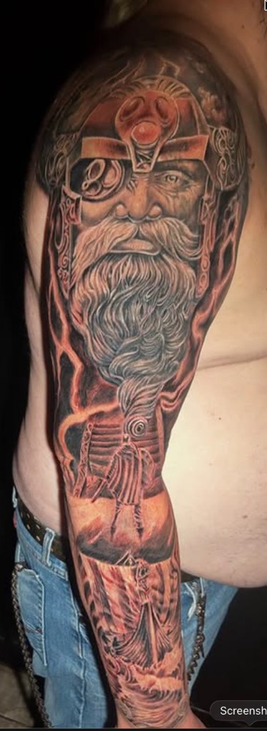 Norse Odin portrait sleeve with Viking ship and red lightning bolts. — Joshua Cole, Work of Art Las Vegas