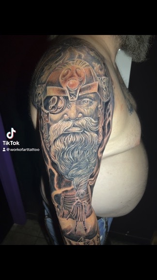 Odin portrait with gem helmet, gear monocle and lightning bolts wrapping shoulder and arm — Joshua Cole, Work of Art Las Vegas